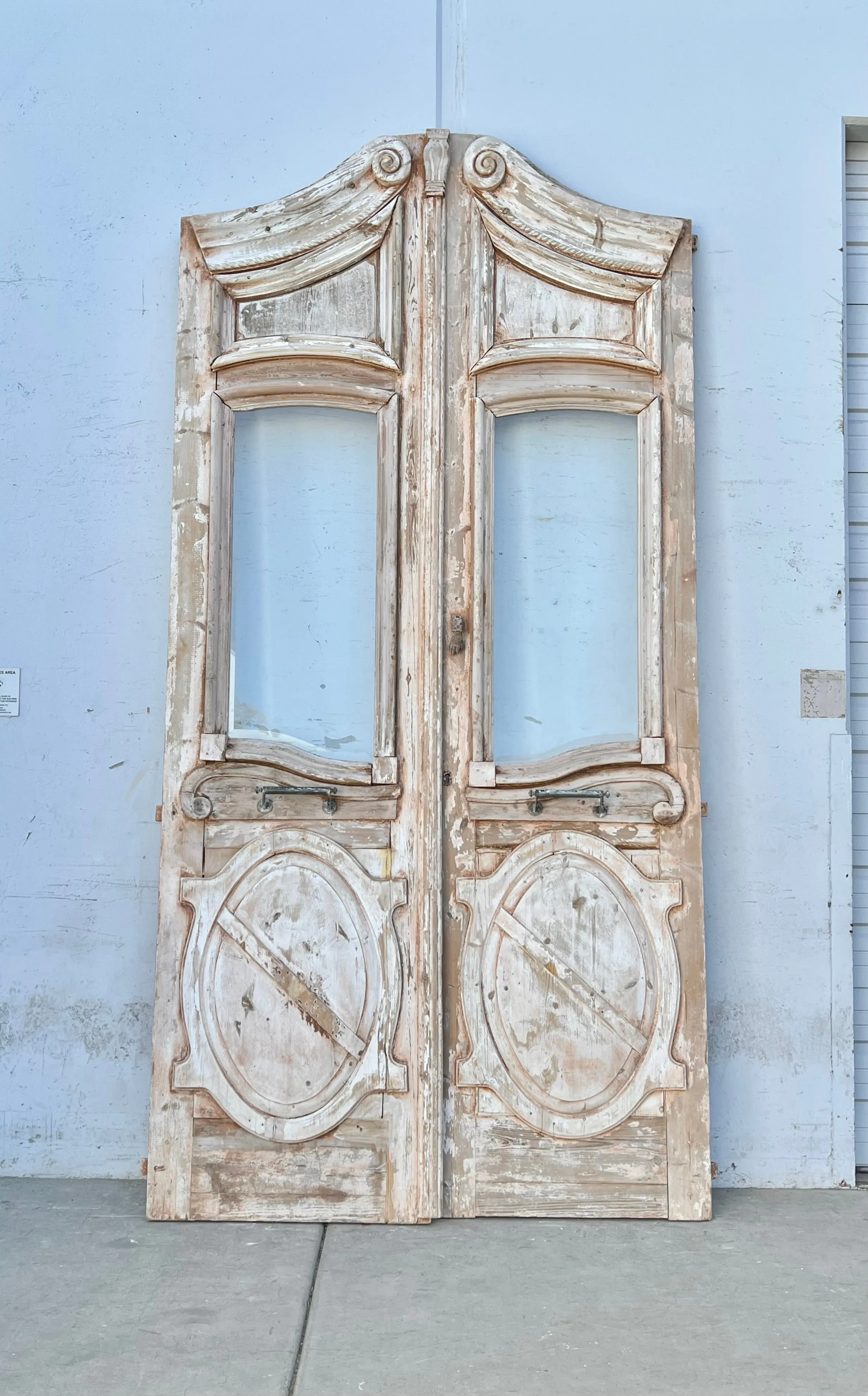 Pair of Washed Antique Wood Arched Single Lite Carved Doors with Raised Panels