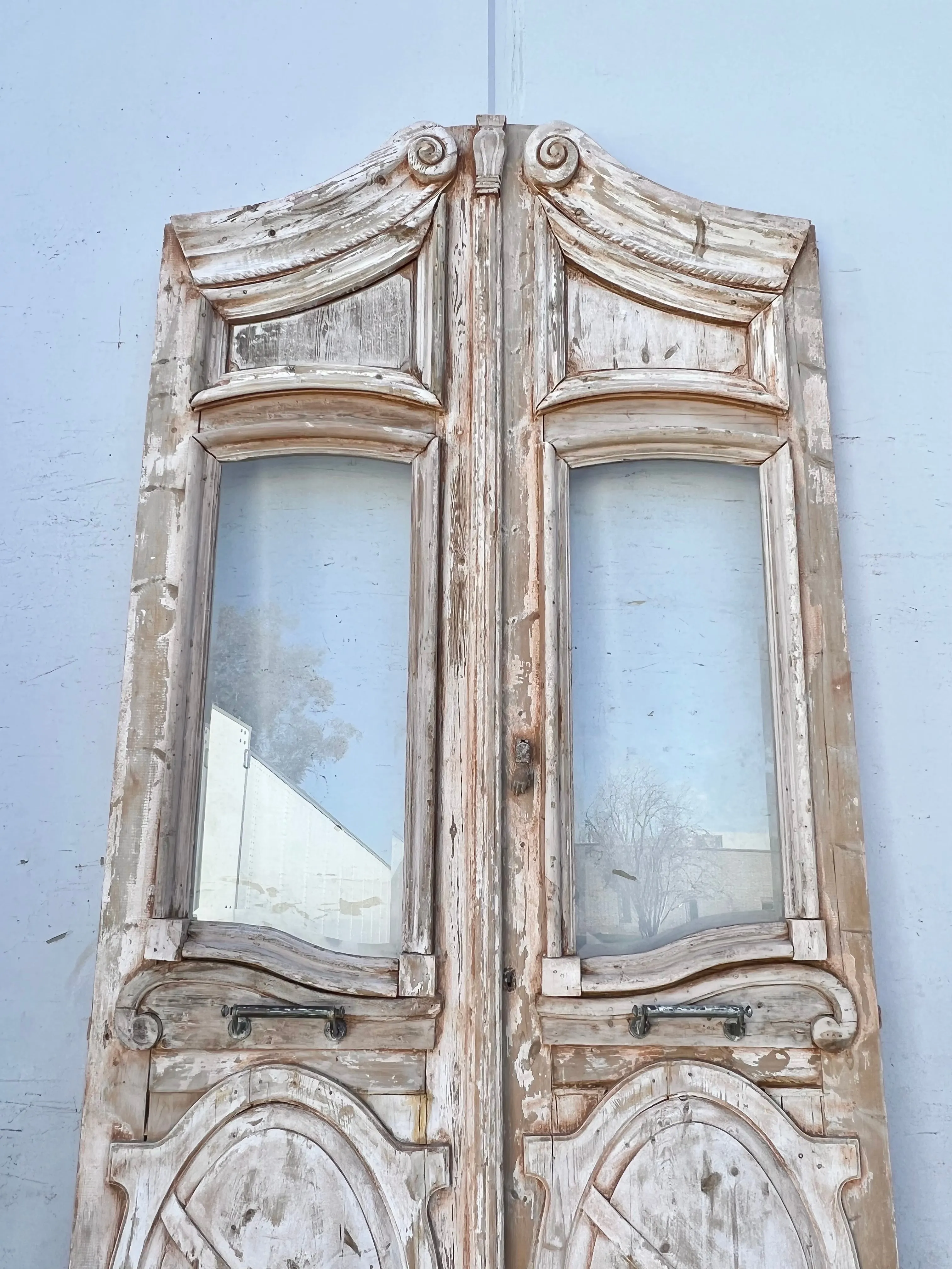 Pair of Washed Antique Wood Arched Single Lite Carved Doors with Raised Panels